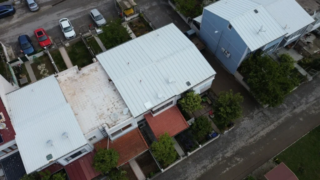 Raw drone survey image of a complex two-story residential roof, captured to be processed by advanced solar design software render-a